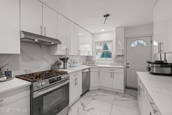 Interior, Kitchen, Marble, Marble Walls, Recessed Lighting, Stainless Steel Appliances