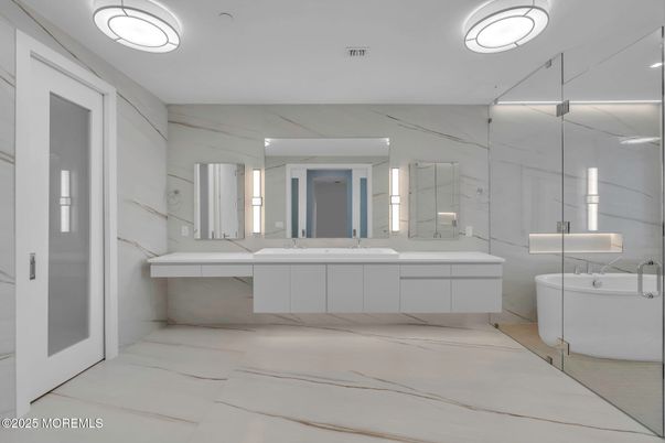 Bathroom, Dual Sink Vanities, Free Standing Baths, Glass Shower, Interior, Marble Walls, Recessed Lighting
