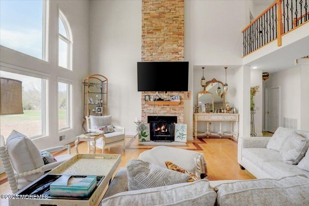 Fireplace, Interior, Living room, Recessed Lighting, Stone Walls, Wood Texture Flooring