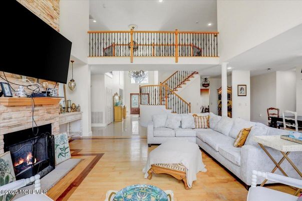 Dining room, Fireplace, Interior, Living room, Recessed Lighting, Wood Texture Flooring