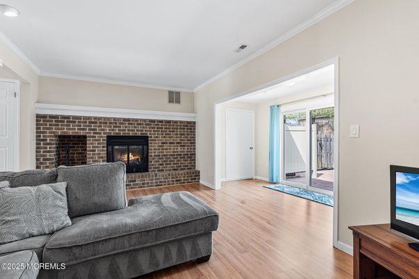 Fireplace, Interior, Living room, Recessed Lighting, Stone Walls, Wood Texture Flooring