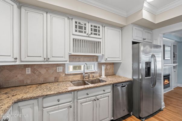 Fireplace, Interior, Kitchen, Stainless Steel Appliances, Wood Texture Flooring
