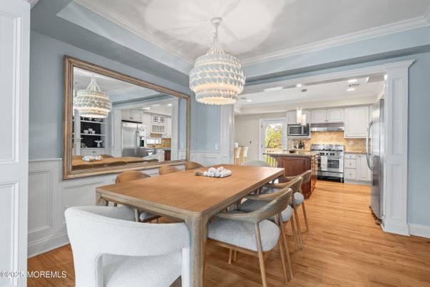 Chandelier, Dining room, Interior, Kitchen, Pendant Lights, Recessed Lighting, Stainless Steel Appliances, Wood Texture Flooring
