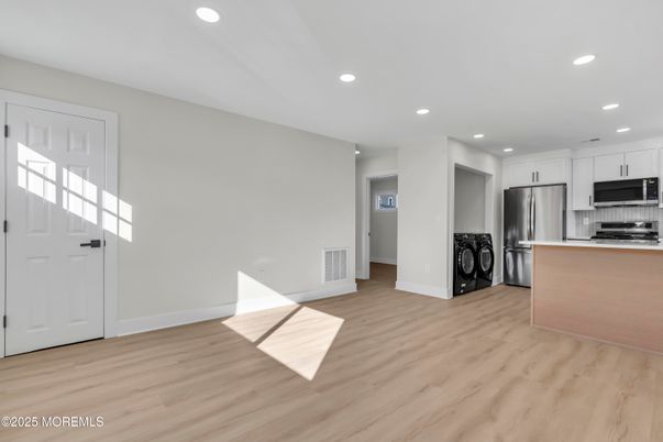 Interior, Kitchen, Recessed Lighting, Stainless Steel Appliances, Washer, Wood Texture Flooring