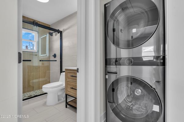Bathroom, Glass Shower, Interior, Utility Closets, Washer, Wood Texture Flooring