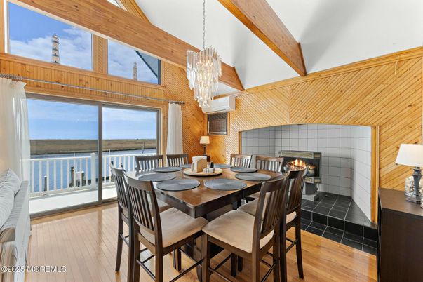 Chandelier, Dining room, Fireplace, Interior, Water, Wooden Beams, Wood Texture Flooring