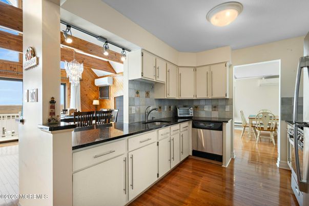 Chandelier, Dining room, Interior, Kitchen, Stainless Steel Appliances, Wood Texture Flooring