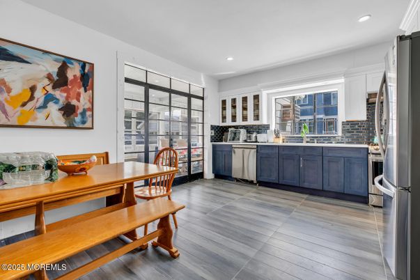 Dining room, Interior, Kitchen, Recessed Lighting, Stainless Steel Appliances, Wood Texture Flooring