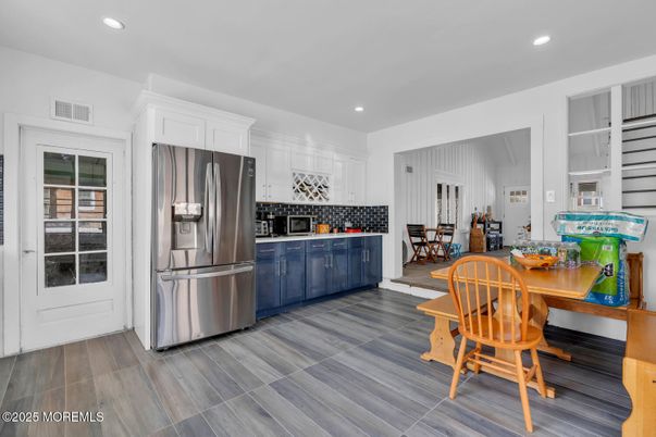 Dining room, Interior, Kitchen, Recessed Lighting, Stainless Steel Appliances, Wood Texture Flooring