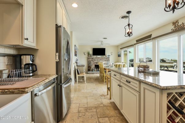 Dining room, Fireplace, Interior, Kitchen, Pendant Lights, Recessed Lighting, Stainless Steel Appliances