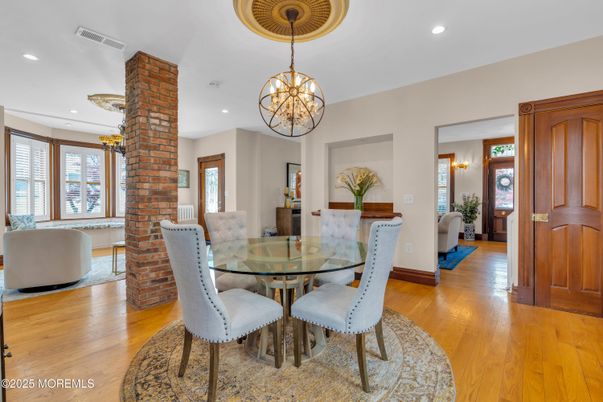 Chandelier, Dining room, Fireplace, Interior, Living room, Pendant Lights, Recessed Lighting, Wood Texture Flooring