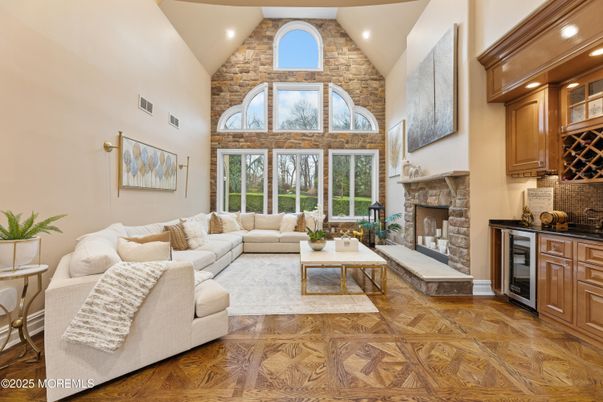 Fireplace, Interior, Living room, Recessed Lighting, Stone Walls, Wood Texture Flooring