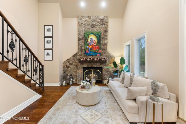 Fireplace, Interior, Living room, Recessed Lighting, Stone Walls, Wood Texture Flooring