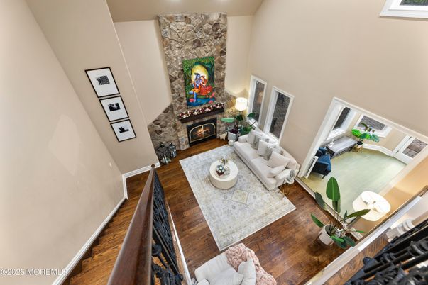 Fireplace, Interior, Living room, Recessed Lighting, Stone Walls, Wood Texture Flooring