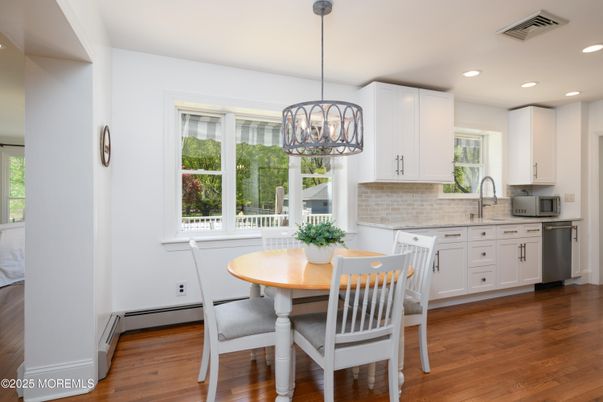 Dining room, Interior, Kitchen, Pendant Lights, Recessed Lighting, Stainless Steel Appliances, Wood Texture Flooring