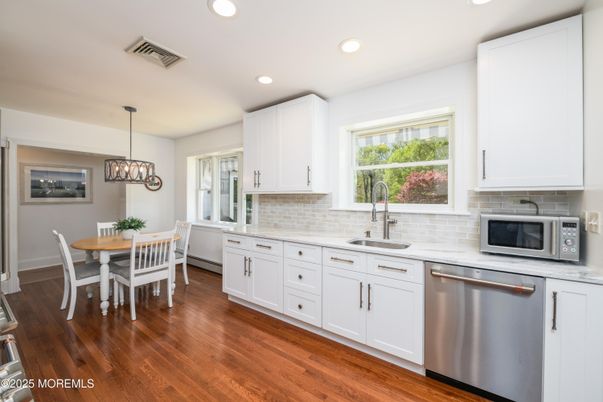 Dining room, Interior, Kitchen, Pendant Lights, Recessed Lighting, Stainless Steel Appliances, Wood Texture Flooring