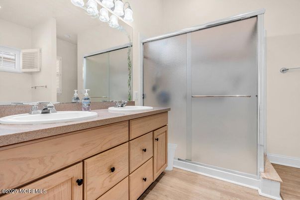 Bathroom, Dual Sink Vanities, Glass Shower, Interior, Wood Texture Flooring