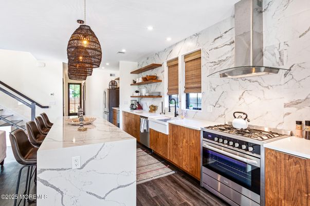 Interior, Kitchen, Marble Walls, Pendant Lights, Recessed Lighting, Stainless Steel Appliances, Wood Texture Flooring