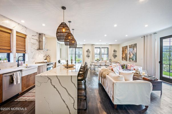 Dining room, Interior, Kitchen, Living room, Marble Walls, Pendant Lights, Recessed Lighting, Stainless Steel Appliances, Wood Texture Flooring