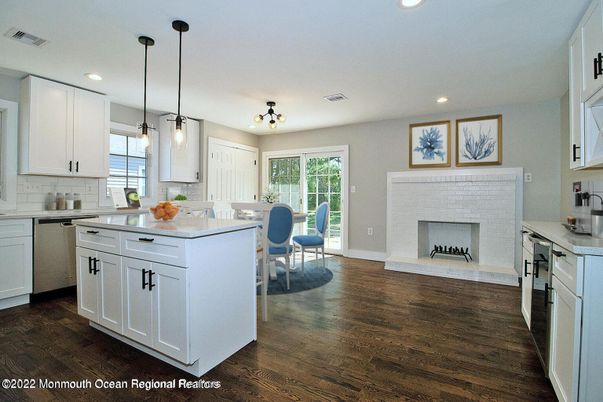 Dining room, Fireplace, Interior, Kitchen, Pendant Lights, Recessed Lighting, Wood Texture Flooring