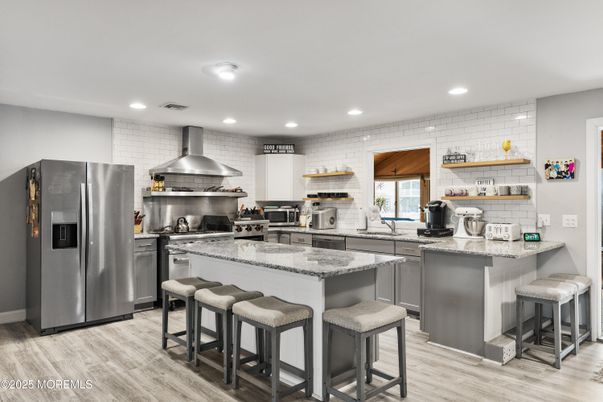 Interior, Kitchen, Recessed Lighting, Stainless Steel Appliances, Stone Walls, Wood Texture Flooring