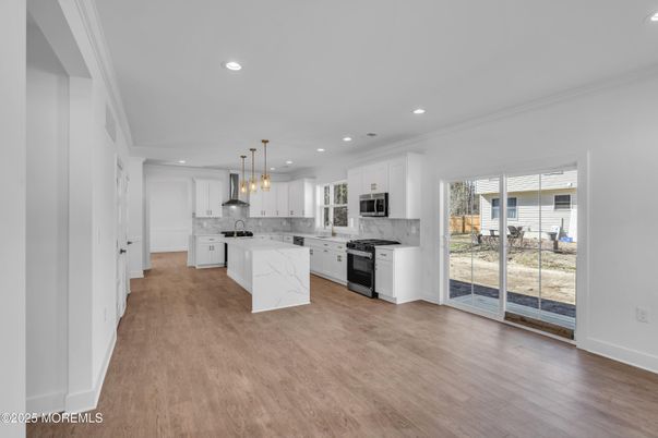 Interior, Kitchen, Marble Walls, Pendant Lights, Recessed Lighting, Stainless Steel Appliances, Wood Texture Flooring