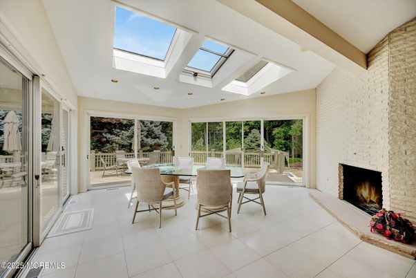 Dining room, Fireplace, Glass Ceilings, Interior, Recessed Lighting, Stone Walls, Sun Room