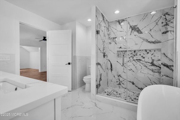 Bathroom, Free Standing Baths, Glass Shower, Interior, Marble, Marble Walls, Recessed Lighting