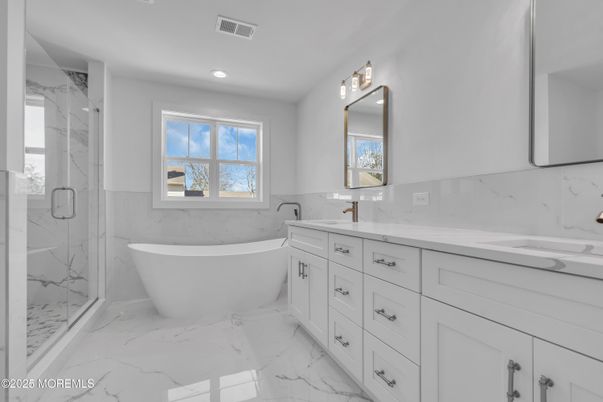 Bathroom, Dual Sink Vanities, Free Standing Baths, Glass Shower, Interior, Marble, Marble Walls, Recessed Lighting