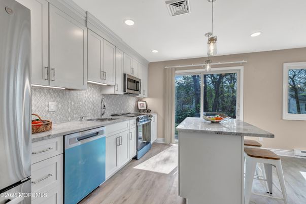 Interior, Kitchen, Pendant Lights, Recessed Lighting, Stainless Steel Appliances, Wood Texture Flooring