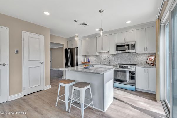 Interior, Kitchen, Pendant Lights, Recessed Lighting, Stainless Steel Appliances, Wood Texture Flooring