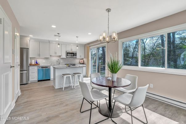 Dining room, Interior, Kitchen, Pendant Lights, Recessed Lighting, Stainless Steel Appliances, Wood Texture Flooring