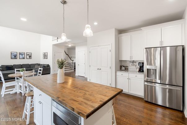 Dining room, Interior, Kitchen, Living room, Pendant Lights, Recessed Lighting, Stainless Steel Appliances, Wood Texture Flooring