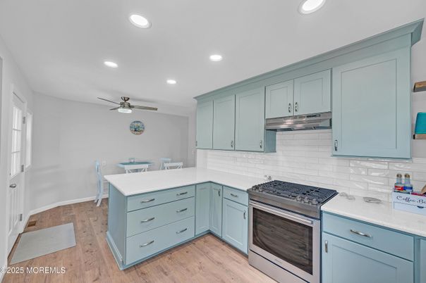 Dining room, Interior, Kitchen, Recessed Lighting, Stainless Steel Appliances, Wood Texture Flooring