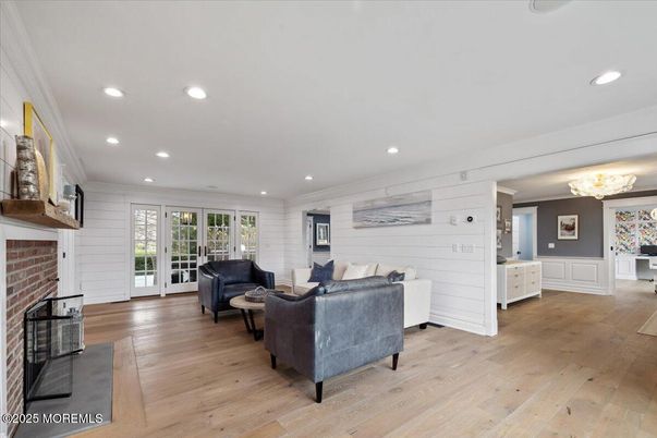 Fireplace, Interior, Living room, Recessed Lighting, Stone Walls, Wood Texture Flooring