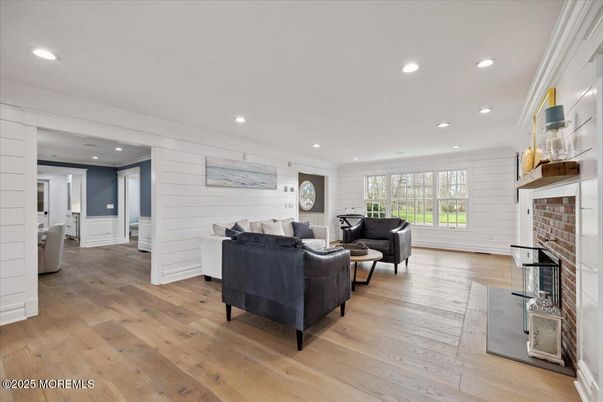 Fireplace, Interior, Living room, Recessed Lighting, Stone Walls, Wood Texture Flooring