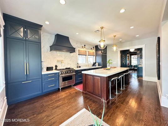 Interior, Kitchen, Marble Walls, Pendant Lights, Recessed Lighting, Stainless Steel Appliances, Wood Texture Flooring