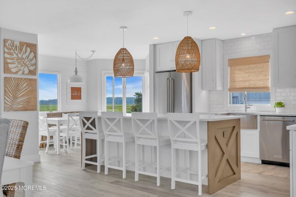 Dining room, Interior, Kitchen, Pendant Lights, Recessed Lighting, Stainless Steel Appliances, Wood Texture Flooring