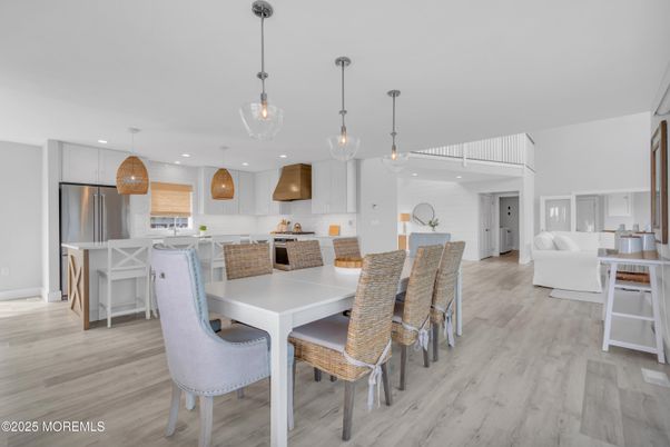 Dining room, Interior, Kitchen, Pendant Lights, Recessed Lighting, Stainless Steel Appliances, Wood Texture Flooring
