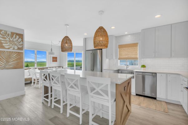Dining room, Interior, Kitchen, Pendant Lights, Recessed Lighting, Stainless Steel Appliances, Wood Texture Flooring