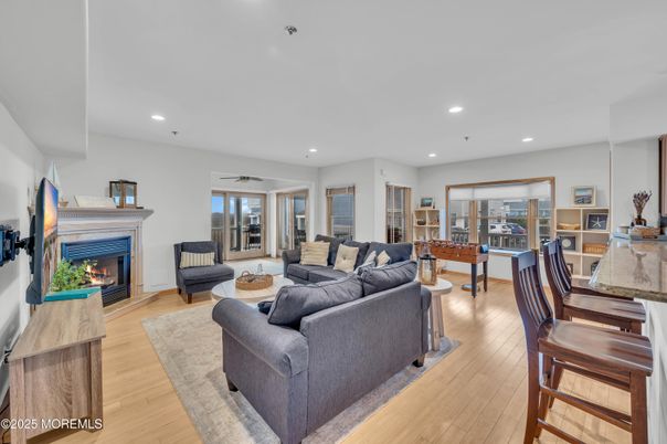 Dining room, Fireplace, Interior, Living room, Recessed Lighting, Wood Texture Flooring