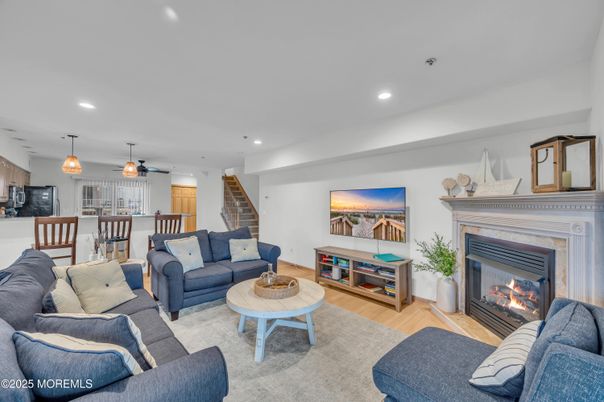 Dining room, Fireplace, Interior, Living room, Pendant Lights, Recessed Lighting, Wood Texture Flooring