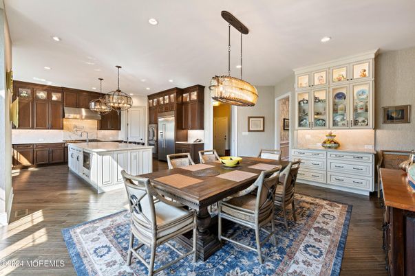 Chandelier, Dining room, Interior, Kitchen, Pendant Lights, Recessed Lighting, Stainless Steel Appliances, Wood Texture Flooring