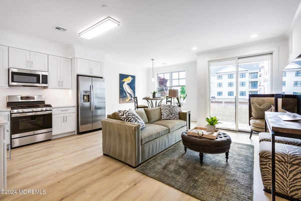 Dining room, Interior, Kitchen, Living room, Pendant Lights, Recessed Lighting, Stainless Steel Appliances, Wood Texture Flooring