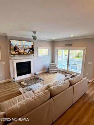 Fireplace, Interior, Living room, Recessed Lighting, Water, Wood Texture Flooring