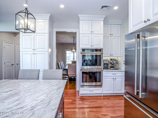 Dining room, Interior, Kitchen, Pendant Lights, Recessed Lighting, Stainless Steel Appliances, Wood Texture Flooring