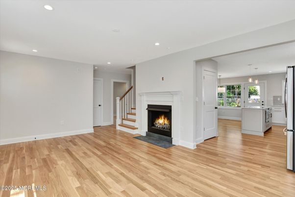 Empty room, Fireplace, Interior, Kitchen, Pendant Lights, Recessed Lighting, Wood Texture Flooring