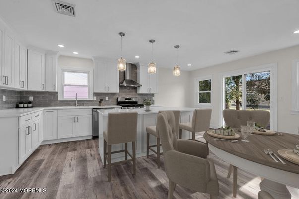 Dining room, Interior, Kitchen, Pendant Lights, Recessed Lighting, Stainless Steel Appliances, Wood Texture Flooring