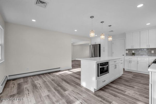 Interior, Kitchen, Pendant Lights, Recessed Lighting, Stainless Steel Appliances, Wood Texture Flooring