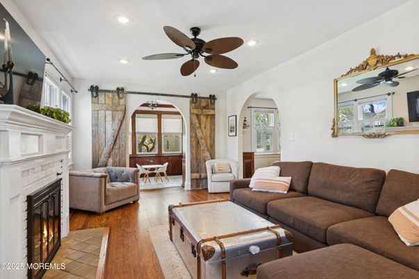 Dining room, Fireplace, Interior, Living room, Recessed Lighting, Wood Texture Flooring